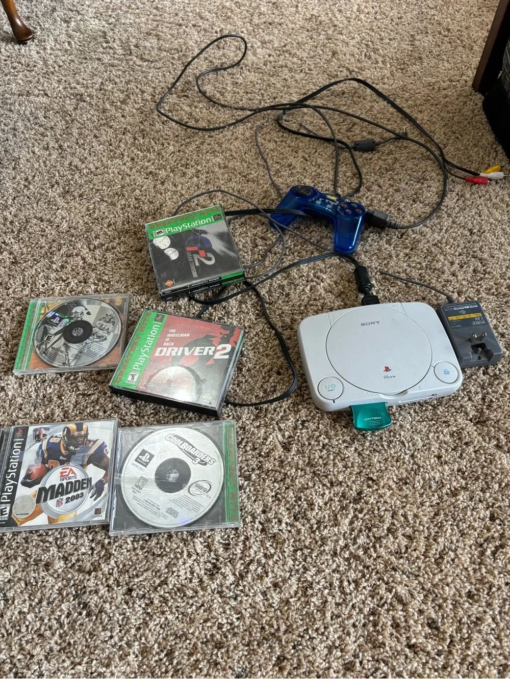 Sony PlayStation 1 with MadCatz controller and games
